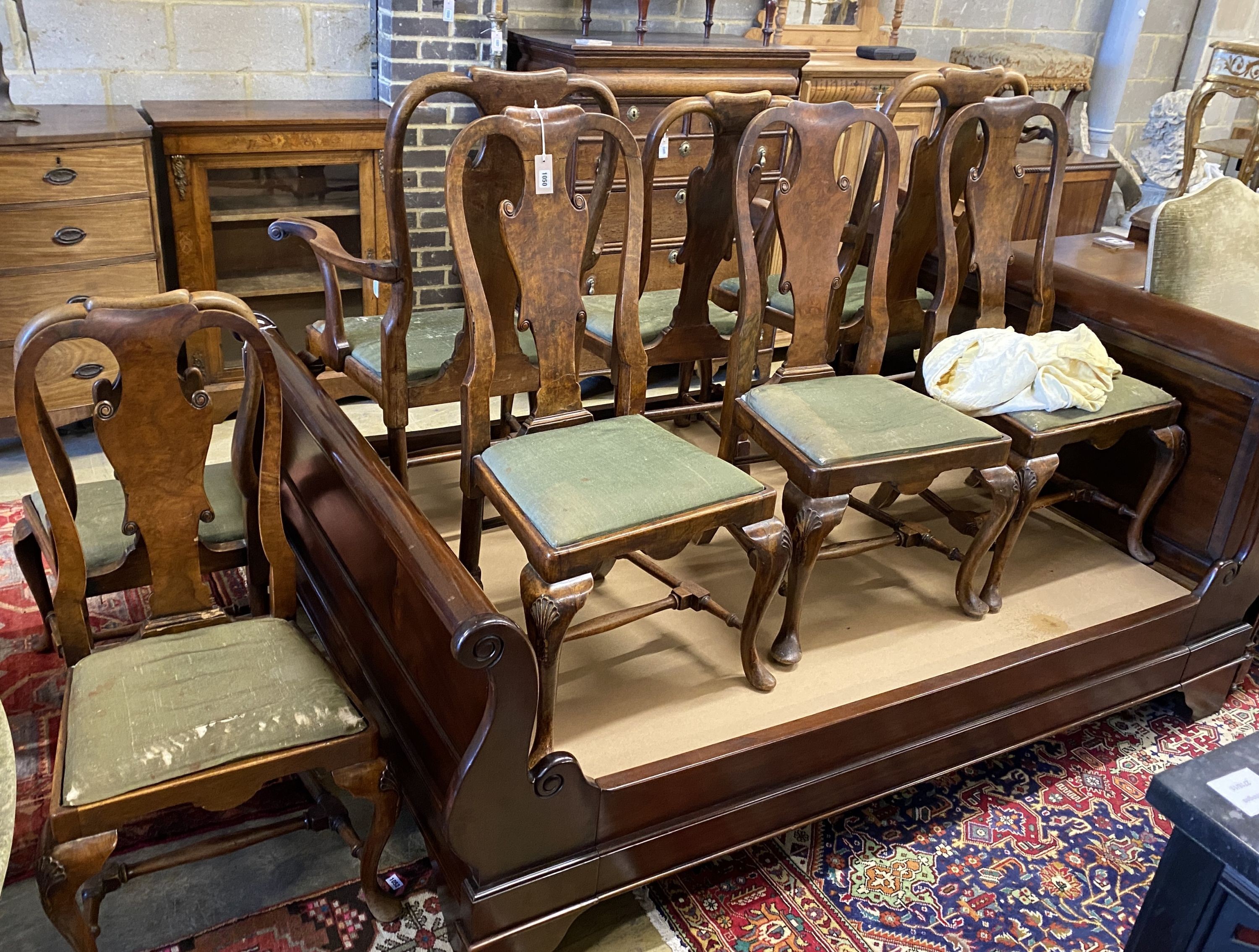 A set of eight George I style walnut dining chairs, two with arms.